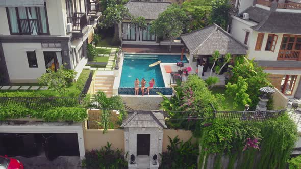 Flight Overlooking the Villa and Girls Near Uluwatu Town on Bali Island Indonesia