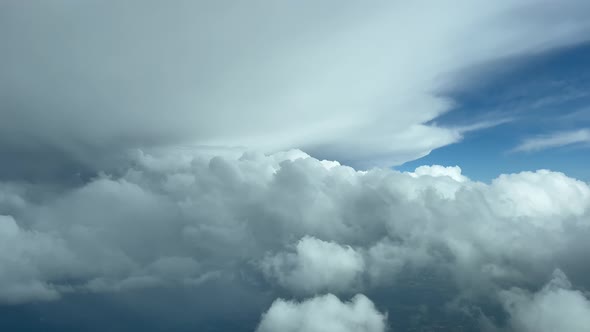 COCKPIT VIEW - Mesmerising pilot view flying towards stormy clouds, high altitude