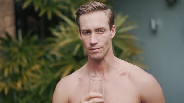 Close Up Portrait of Caucasian Man Drinks Fresh Water