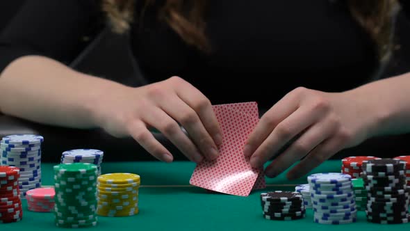 Woman Looking at Her Cards and Pushing All-In, Justified Risk, Poker Gambling