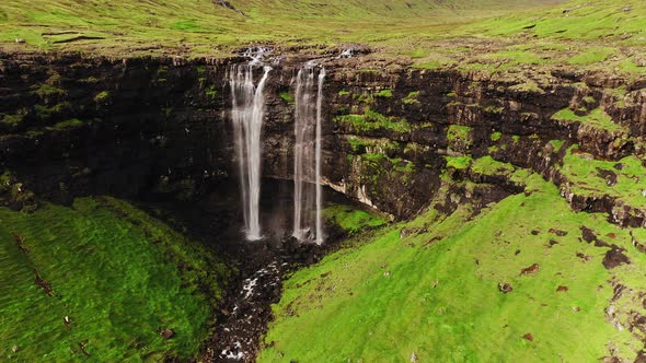 Aerial View of Stunning Waterfall in Faroe Islands