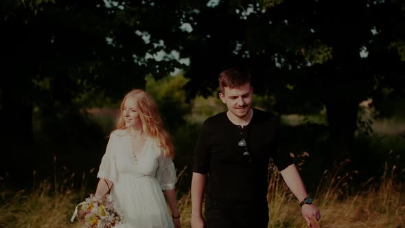 Positive Boho Couple Walk in Forest in Summer