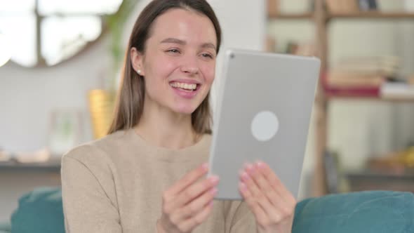 Video Chat on Tablet By Young Woman
