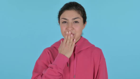 Indian Girl Giving Flying Kiss Blue Background