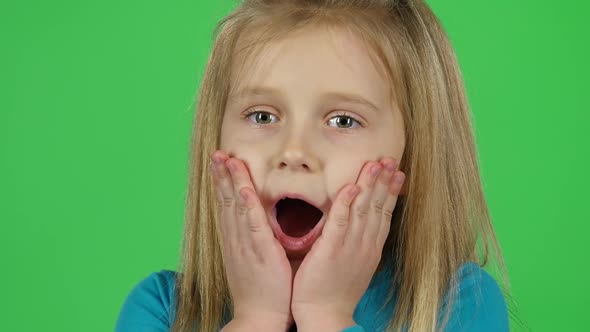 Close-up of Little Girl Posing Shows Frightened Emotion. Slow Motion