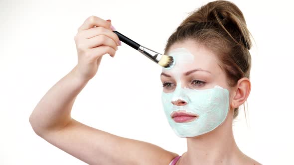 Girl Apply Green Mud Mask to Face