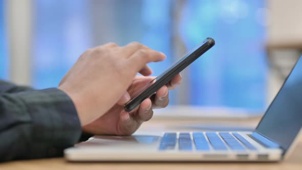 Close Up of African American Man Using Smartphone