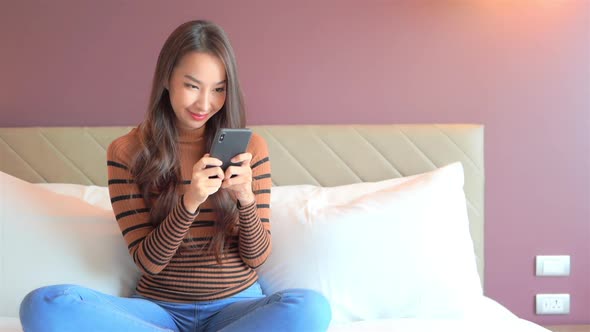 Young asian woman use smart phone