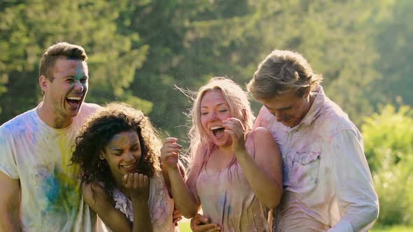 Water Sprayed on Excited Smiling Friends, Young People Having Fun in Summer