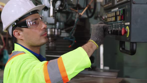 Smart Factory Worker Using Machine in Factory Workshop