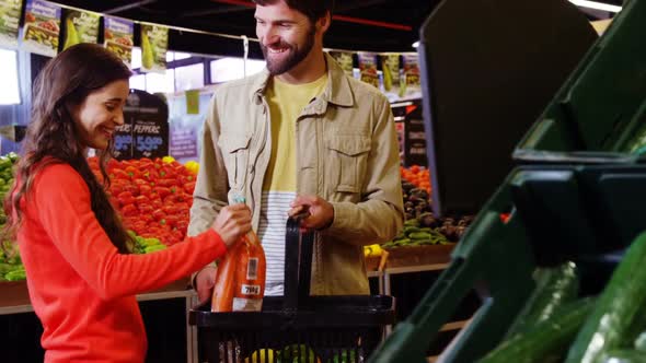 Couple buying vegetables in organic shop