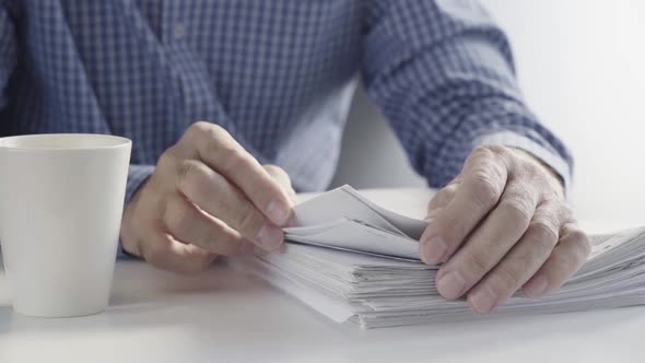 The Clerk's Hands are Working with Paper Files