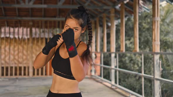 Woman Fighter Trains Her Punches Training Day in the Abandoned Hotel Strength Fit Body