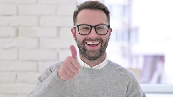 Portrait of Creative Man Showing Thumbs Up