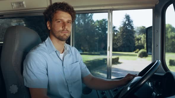 School Bus Driver Sitting Cabin Close Up