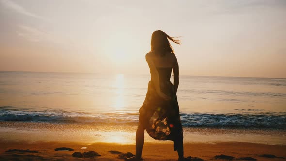 Amazing Shot of Young Beautiful Happy Woman Walking, Running Along Idyllic Epic Sunset Sea Beach