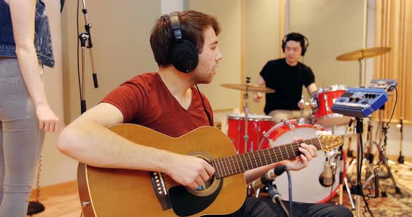 Music band performing in studio
