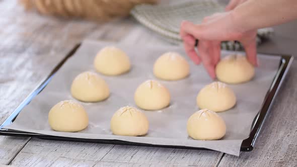 Woman Makes Homemade Breakfast Buns. Making Buns, Dough on a Baking Tray