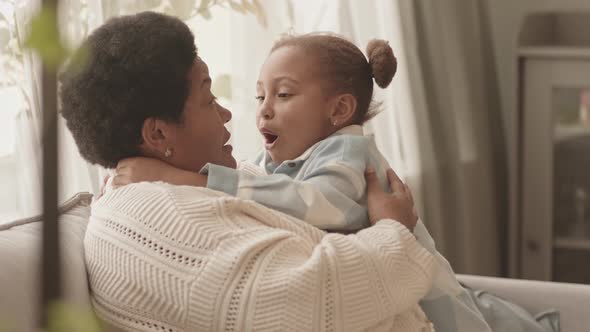 Little Girl Kissing Grandma