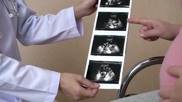 Pregnant Woman and Gynecologist Doctor at Hospital