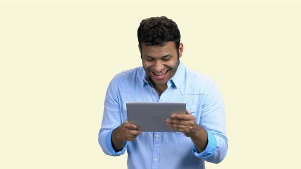 Cheerful Indian Man with Tablet Pc on White Background