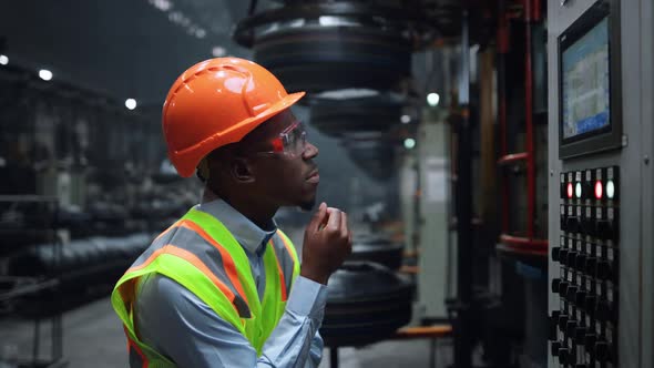 Man Worker Tapping Screen Modern Metal Construction at Huge Industrial Factory