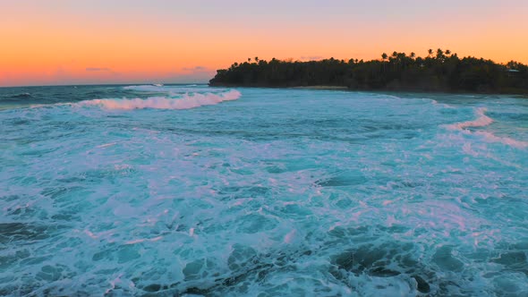 View of Storm Seascape and Wave Breaks Along the Shore at Beautiful Sunset Time