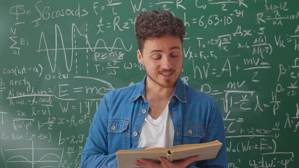 Medium Shot of Teacher with Book Holding Math Class