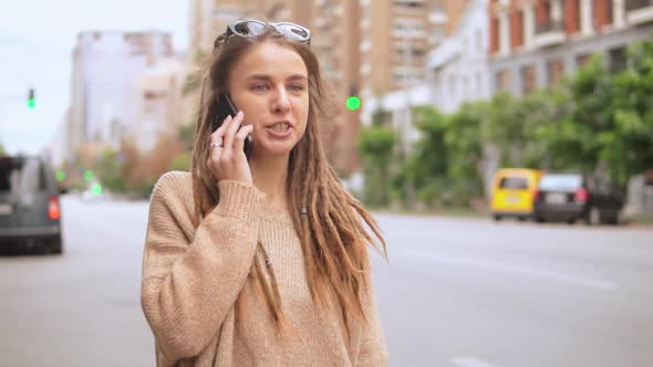 Young Woman Use Mobile Outdoors