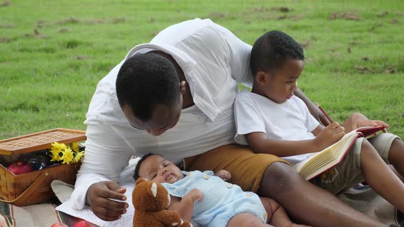 African family hanging out at park