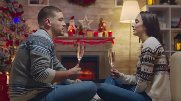 Couple Having a Conversation and Drinking Champagne