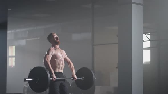 Slow Motion of Crossfit Athlete Performs Clean and Jerk