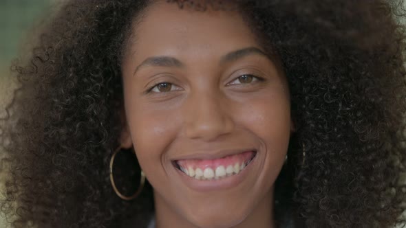 Close Up of Beautiful African Woman Smiling at Camera