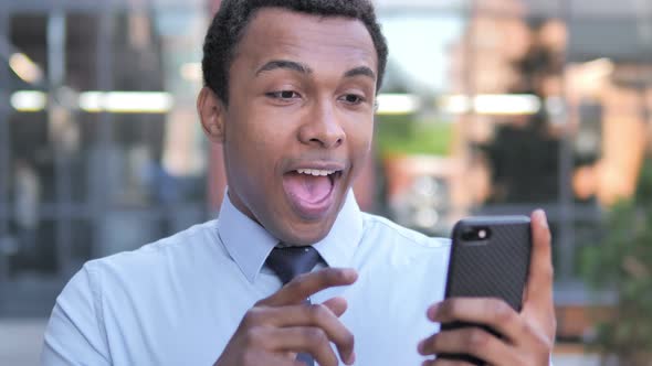 Wow, African Businessman Surprised on Smartphone