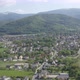 Flying above small city under Mountains  - VideoHive Item for Sale