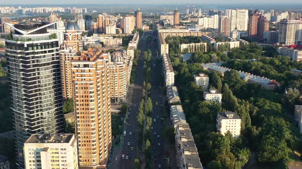 Aerial drone video of downtown skyline buildings and cars on the highway in Pecherskyi district of K