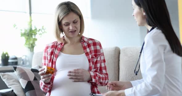 Doctor Passes Medicine Pills to Pregnant Woman at Home