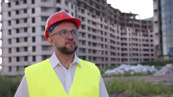 Close Up Slow View of Young Builder in Glasses