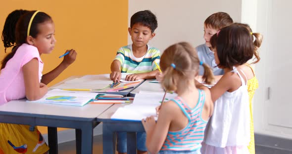 School kids studying in classroom