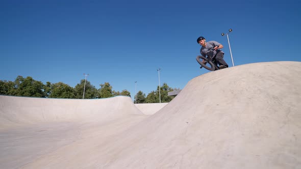 Man Jumping Over The Hill