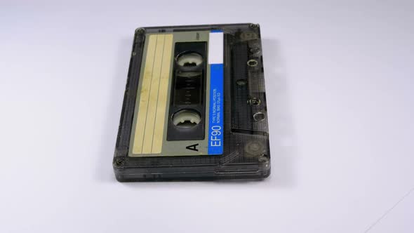 Vintage Audio Cassette Rotates on White Background