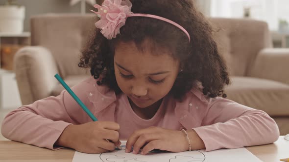 Girl Drawing and Smiling on Camera