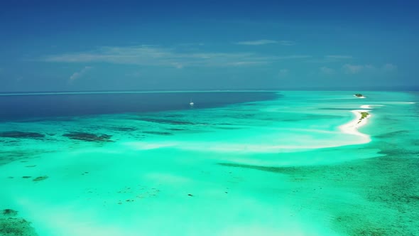 Aerial drone seascape of tranquil resort beach time by aqua blue lagoon and white sandy background o