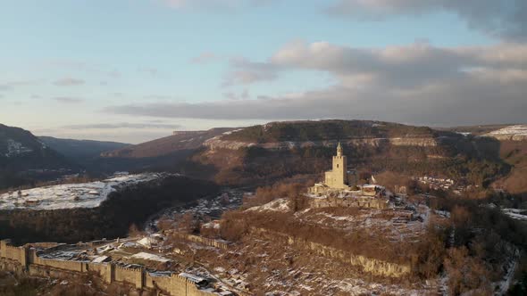 Aerial video above a hill with an old fortress