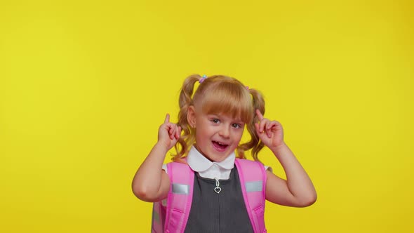 School Girl Kid in Uniform Showing Thumbs Up Pointing Up at Copy Space for Promotional Content
