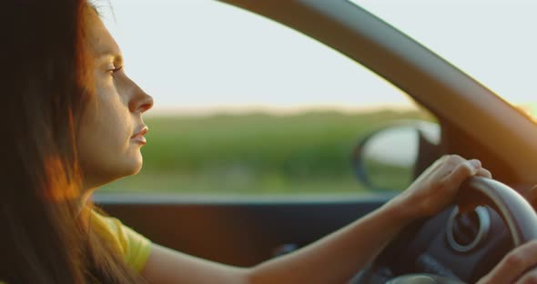 Close Up Girl Driving Car Outside City