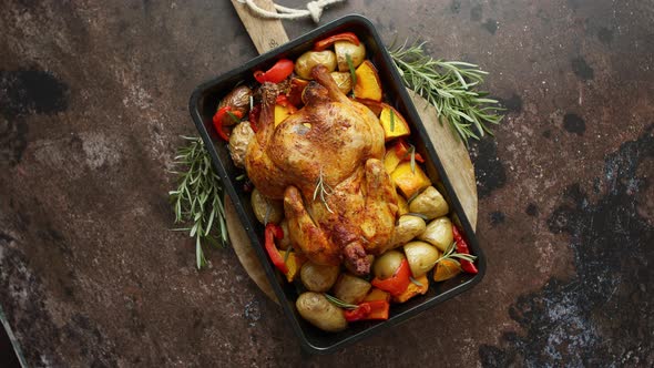 Delicious Whole Chicken Cooked with Pumpkin, Pepper and Potatoes. Served in Metal Baking Pan