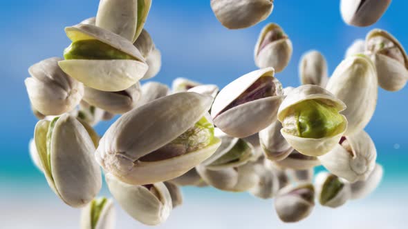 Flying of Pistachios in Sky Background