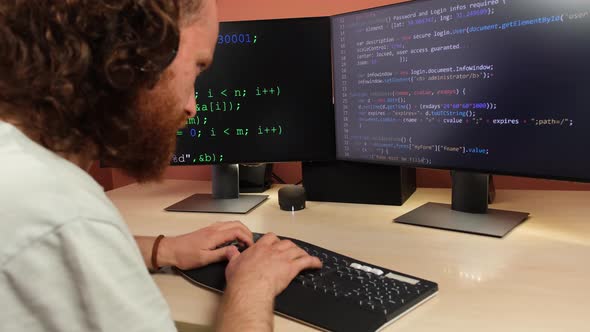 Programmer Writes Code On Computer