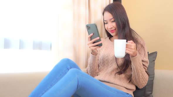 Young asian woman use smart phone